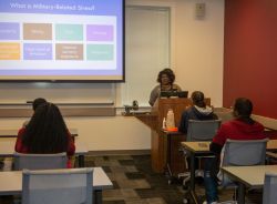 : Dr. Nikki Wooten, coordinator for the Graduate Certificate in Social and Behavioral Health with Military Members, Veterans and Military Families, teaches her “Military Mental Health and the Impact of Trauma” class : Dr. Nikki Wooten, coordinator for the Graduate Certificate in Social and Behavioral Health with Military Members, Veterans and Military Families, teaches her “Military Mental Health and the Impact of Trauma” class